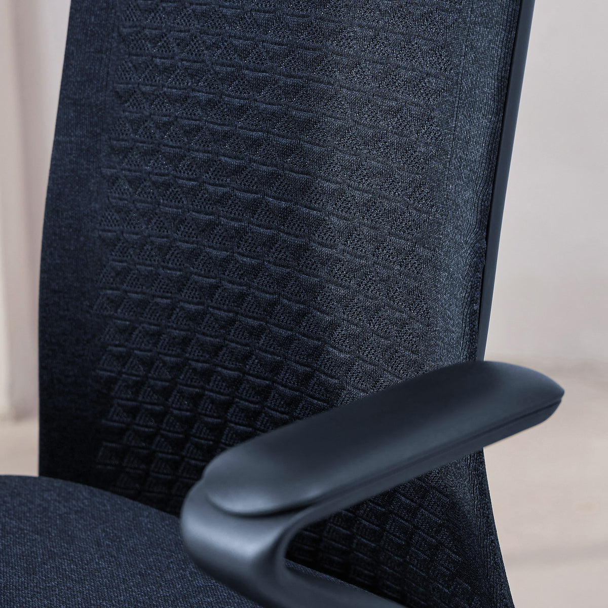 Model 92 Onyx ergonomic office chair with textured backrest and black armrest