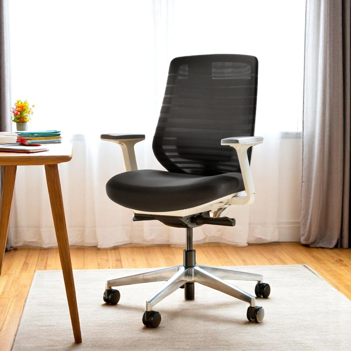 Pelicanwork Model 11 ergonomic office chair in black, mesh backrest, in modern workspace